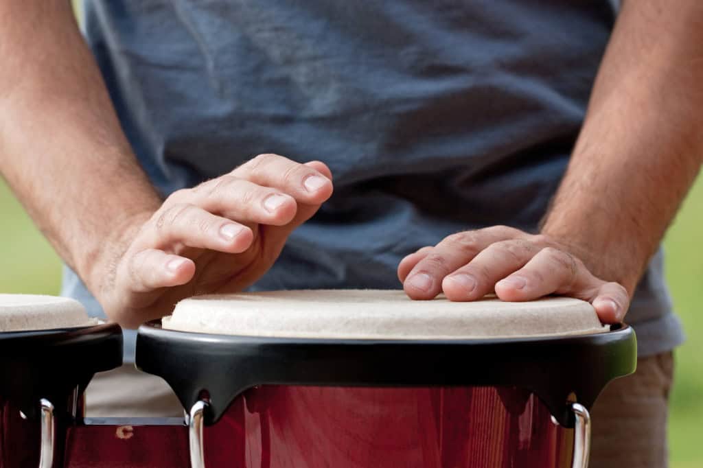 Salsa musician playing bongos